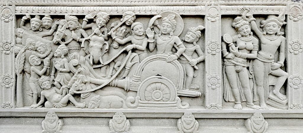 Buddhist relief at Mahabodhi Vihara in Hyderabad showing the Bodhisattva Siddhartha encountering the signs of old age, sickness, and death, a visual representation of the Four Sights motif in Buddhist tradition.