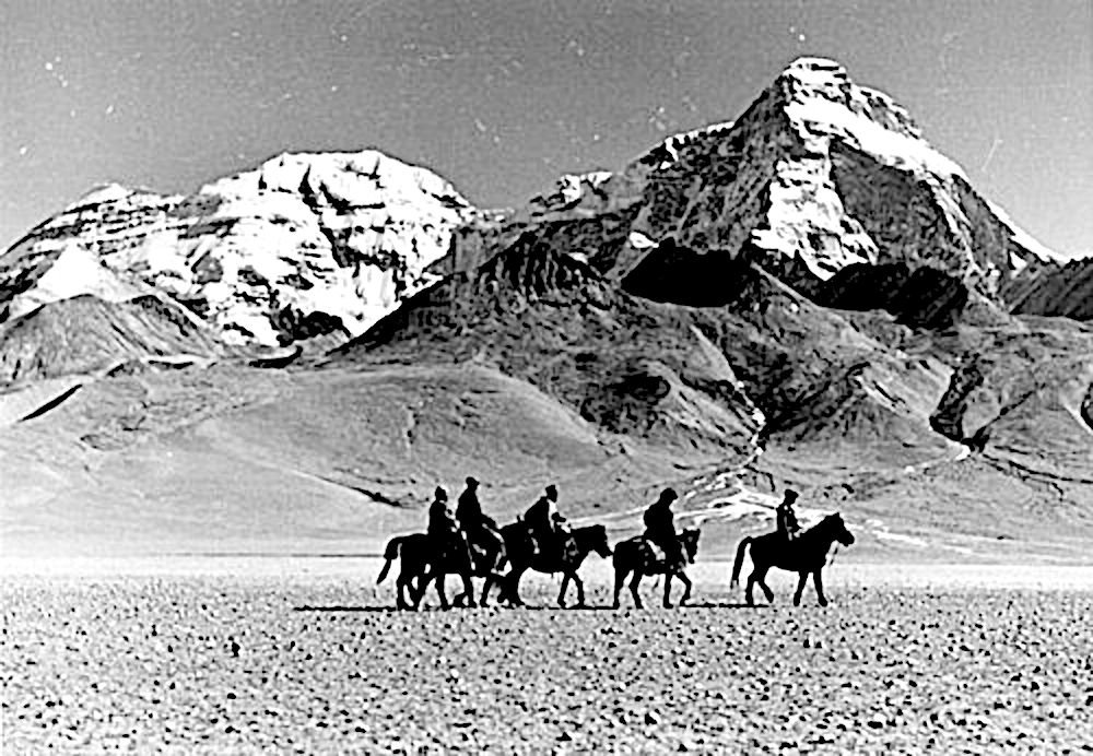 Himalayan caravan with horses traveling near Mount Chomolhari Tibet