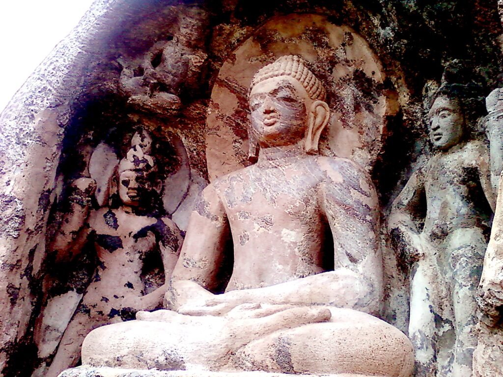 Rock-cut seated Buddha statue at Bojjannakonda, Śaṅkaram, Andhra Pradesh, illustrating the image-centered interior sacred space of early South Indian Buddhism.